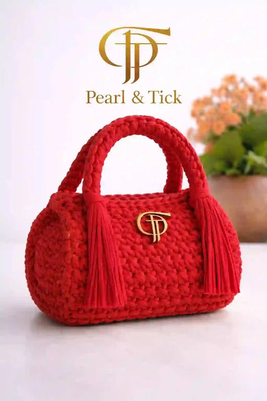 Red handbag with a brand logo on a white background