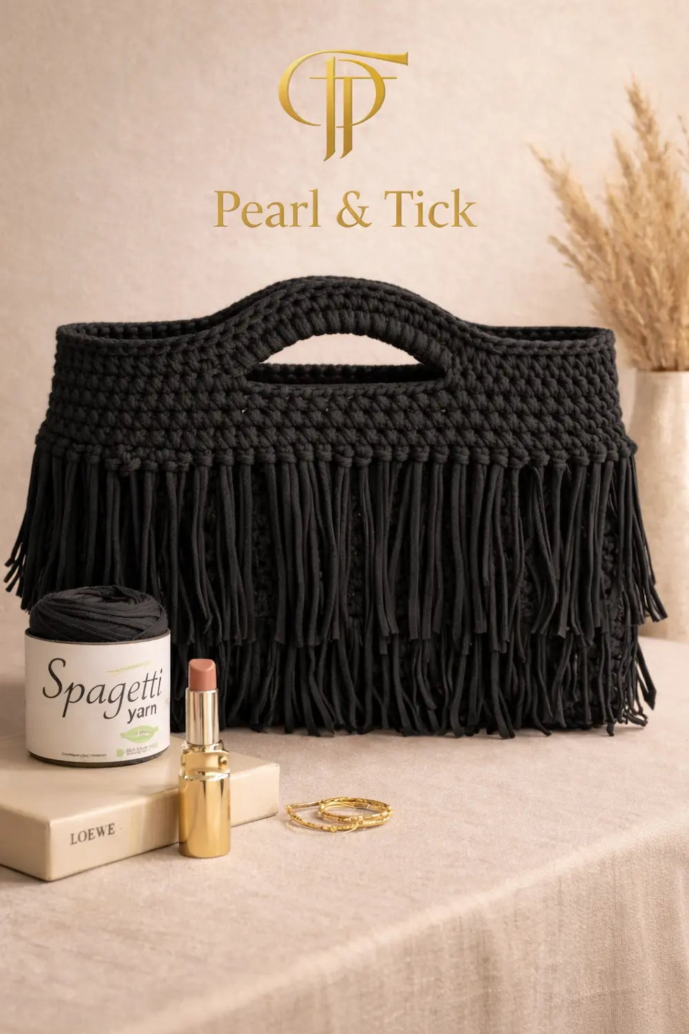 Black macrame bag with 'Pearl & Tick' branding on a neutral background