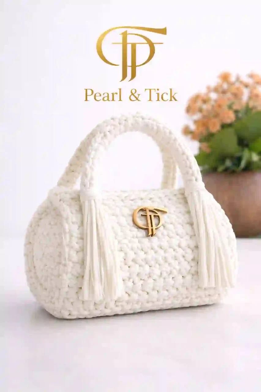 Arvienne Bag - Pearl & TickArvienne BagHandbagsPearl & TickPearl & TickARVIENNE-WHTWhiteWhite handbag with a brand logo on a white background