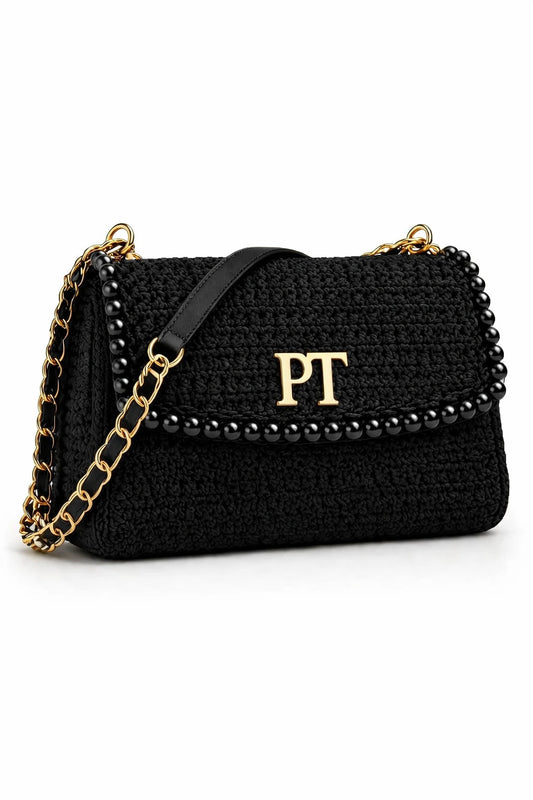 Black handbag with gold chain and 'PT' logo on a white background