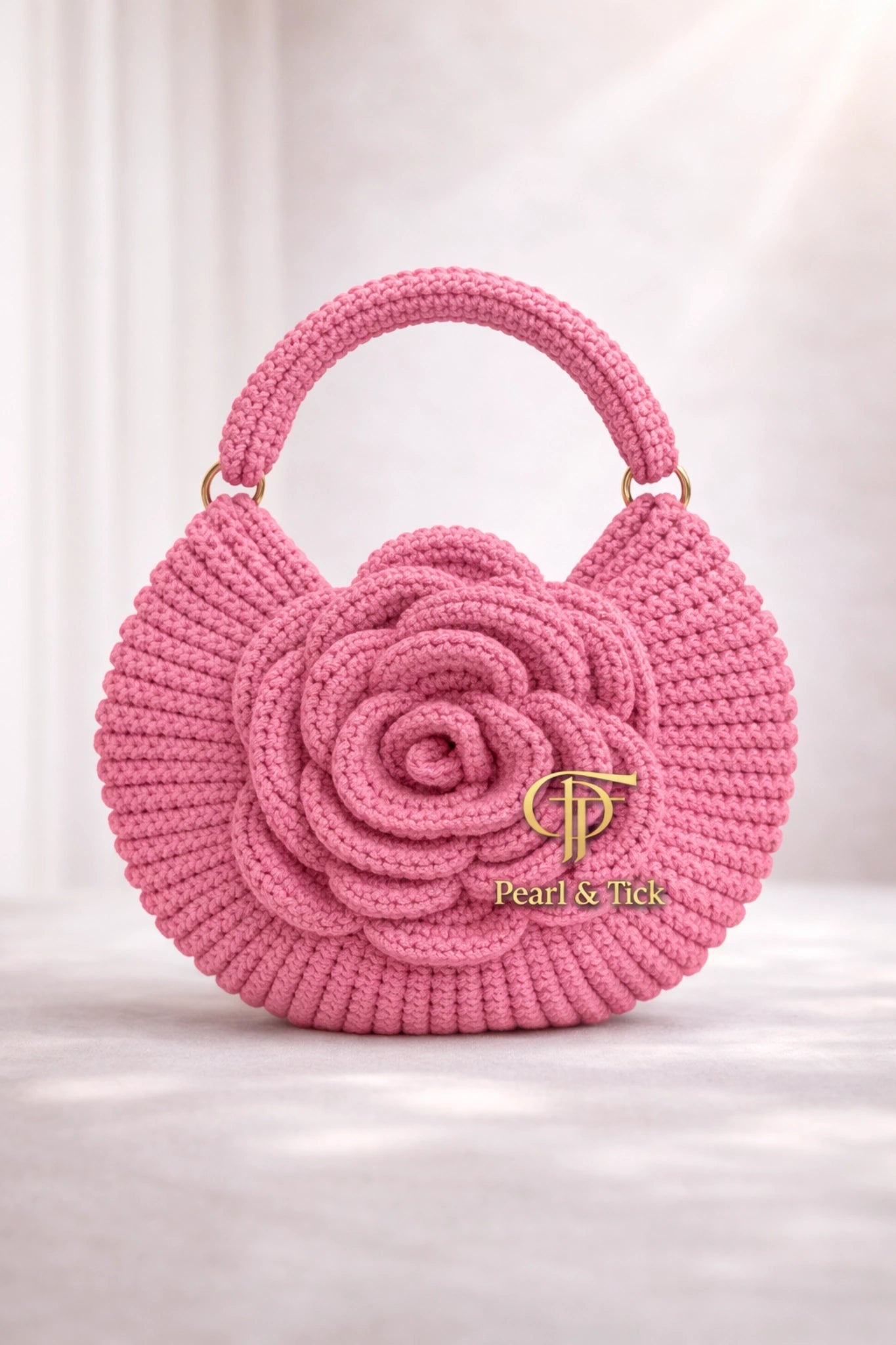 Pearl Rosette - Pearl & TickPearl RosetteHandbagsPearl & TickPearl & TickROSETTE-PNKPinkElegant Pink Rose Handbag: Featuring a sophisticated floral design and the signature Pearl & Tick logo on a pristine white background. This exquisite accessory combines artisanal texture with luxury style for a high - end, cinematic look.