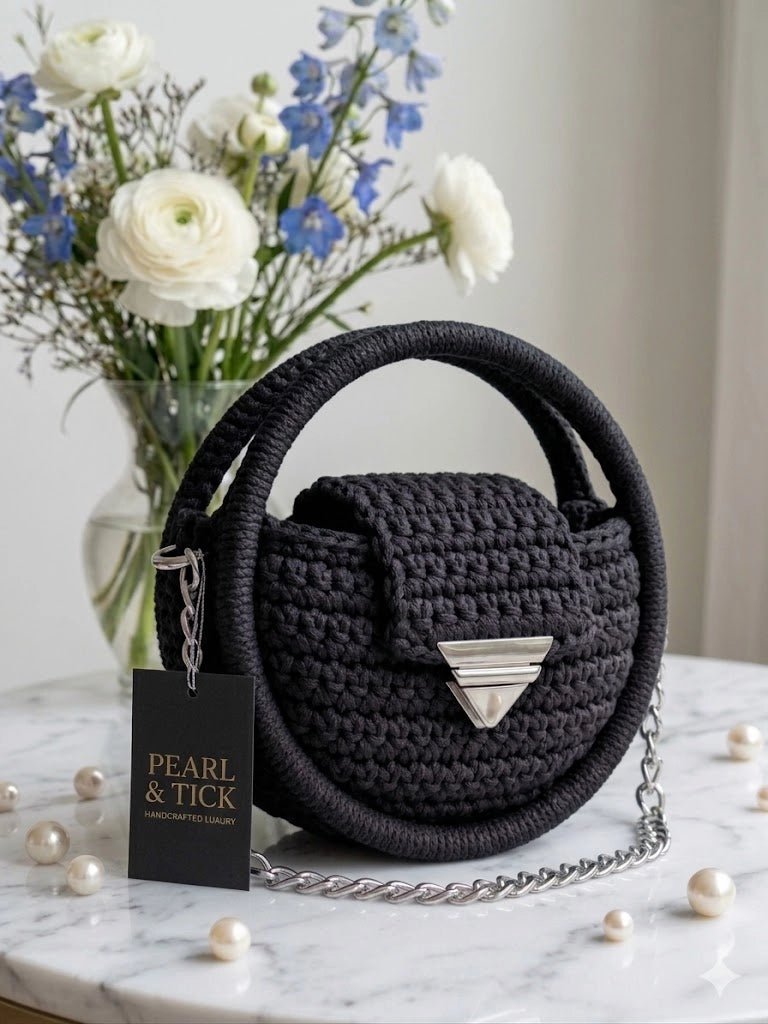 Discover The Nacre Orb by Pearl & Tick — a luxury handcrafted crochet handbag with elegant pearl accents and silver clasp.