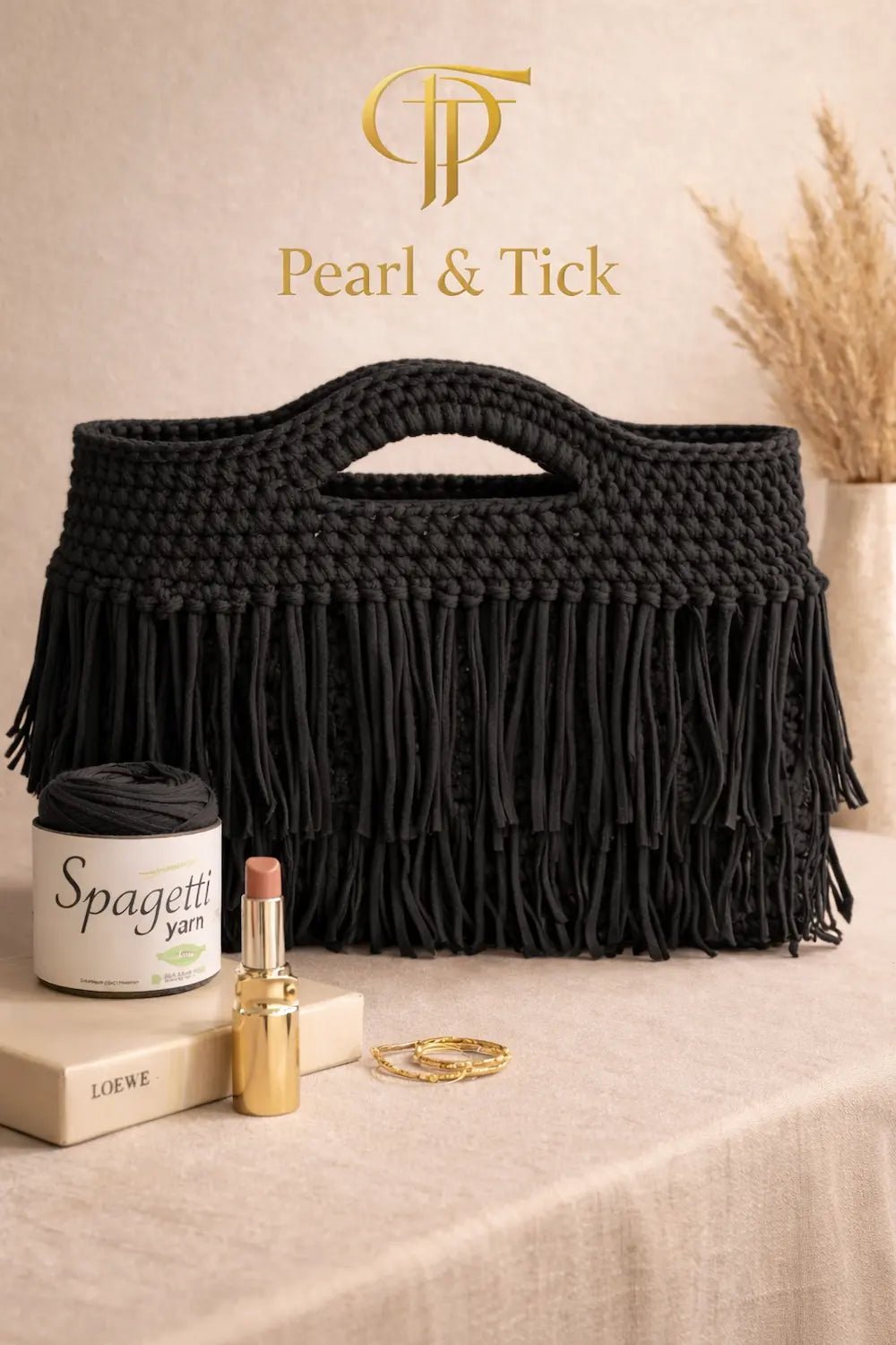 Velora Fringe Bag - Pearl & TickVelora Fringe BagHandbagsPearl & TickPearl & TickVELORA-BLKBlackHandmade black macrame bag with Pearl & Tick logo on a neutral background, stylish boho handbag for women, trendy fashion accessory